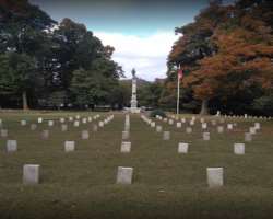There are hundreds of soldiers' graves arranged in the tree-shaded rows.